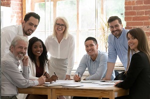 employees sitting around a meeting table