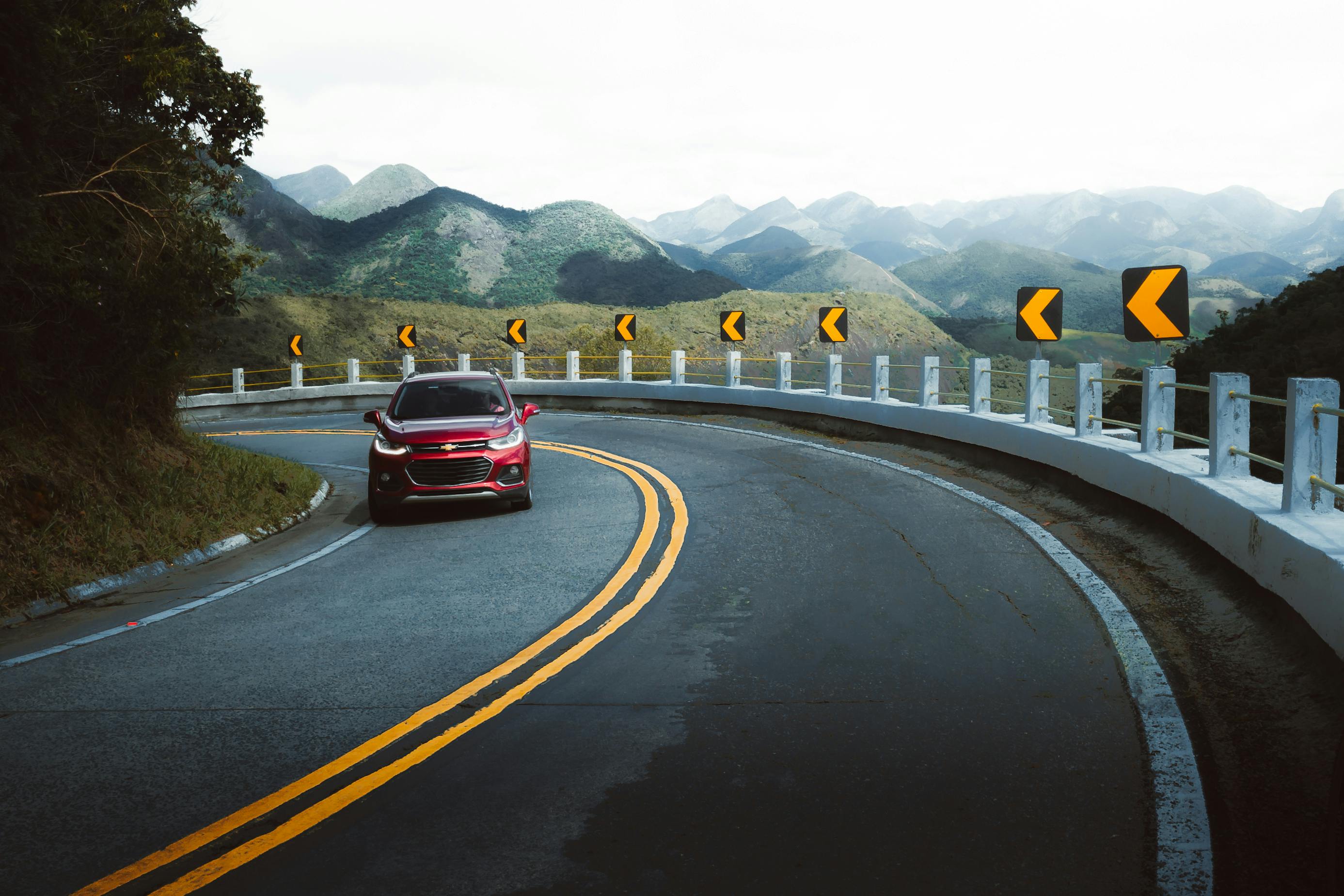 a highway with a mountain in the background
